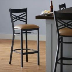Lancaster Table & Seating Black Finish Cross Back Bar Stool With 2 1/2" Light Brown Vinyl Padded Seat