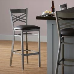 Lancaster Table & Seating Clear Coat Finish Cross Back Bar Stool With 2 1/2" Dark Brown Vinyl Padded Seat