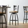 Lancaster Table & Seating Black Finish Cross Back Swivel Bar Stool With 2 1/2" Light Brown Vinyl Padded Seat