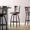 Lancaster Table & Seating Black Finish Cross Back Swivel Bar Stool With 2 1/2" Burgundy Vinyl Padded Seat