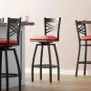 Lancaster Table & Seating Black Finish Cross Back Swivel Bar Stool With 2 1/2" Red Vinyl Padded Seat