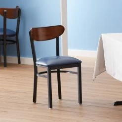 LT&S Boomerang Series Lancaster Table & Seating Boomerang Black Finish Chair With 2 1/2" Navy Vinyl Padded Seat And Antique Walnut Wood Back