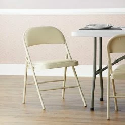 Lancaster Table & Seating Beige Vinyl Folding Chair With Padded Seat