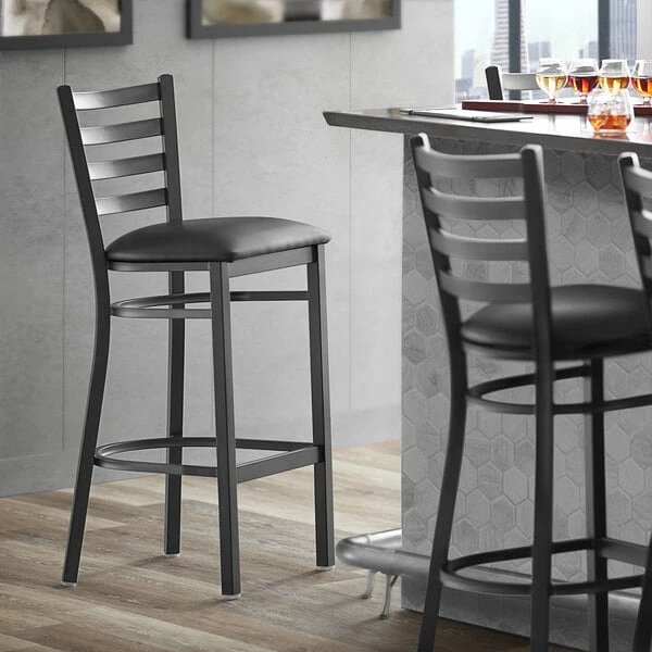 Lancaster Table & Seating Black Finish Ladder Back Bar Height Chair With 2 1/2" Black Vinyl Cushion 1 Lancaster Table & Seating Black Finish Ladder Back Bar Height Chair With 2 1/2" Black Vinyl Cushion
