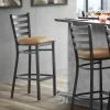 Lancaster Table & Seating Black Finish Ladder Back Bar Stool With 2 1/2" Light Brown Vinyl Padded Seat