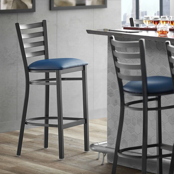 Lancaster Table & Seating Black Finish Ladder Back Bar Stool With 2 1/2" Navy Blue Vinyl Padded Seat 1 Lancaster Table & Seating Black Finish Ladder Back Bar Stool With 2 1/2" Navy Blue Vinyl Padded Seat