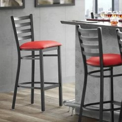 Lancaster Table & Seating Black Finish Ladder Back Bar Stool With 2 1/2" Red Vinyl Padded Seat