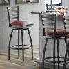 Lancaster Table & Seating Black Finish Ladder Back Swivel Bar Stool With 2 1/2" Burgundy Vinyl Padded Seat