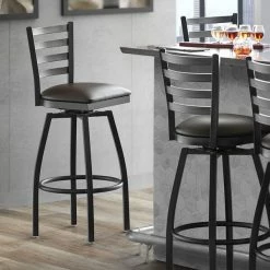 Lancaster Table & Seating Black Finish Ladder Back Swivel Bar Stool With 2 1/2" Dark Brown Vinyl Padded Seat
