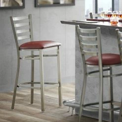 Lancaster Table & Seating Clear Coat Finish Ladder Back Bar Stool With 2 1/2" Burgundy Vinyl Padded Seat
