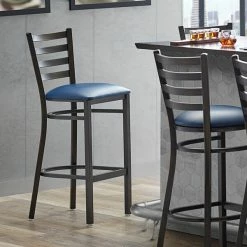 Lancaster Table & Seating Distressed Copper Finish Ladder Back Bar Stool With 2 1/2" Navy Blue Vinyl Padded Seat