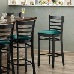Lancaster Table & Seating Black Ladder Back Bar Height Chair With Green Padded Seat
