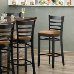 Lancaster Table & Seating Black Ladder Back Bar Height Chair With Light Brown Padded Seat