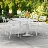 Lancaster Table & Seating 32" X 48" White Powder-Coated Aluminum Dining Height Outdoor Table With Umbrella Hole And 4 Arm Chairs