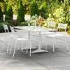 Lancaster Table & Seating 32" X 60" White Powder-Coated Aluminum Dining Height Outdoor Table With Umbrella Hole And 4 Side Chairs