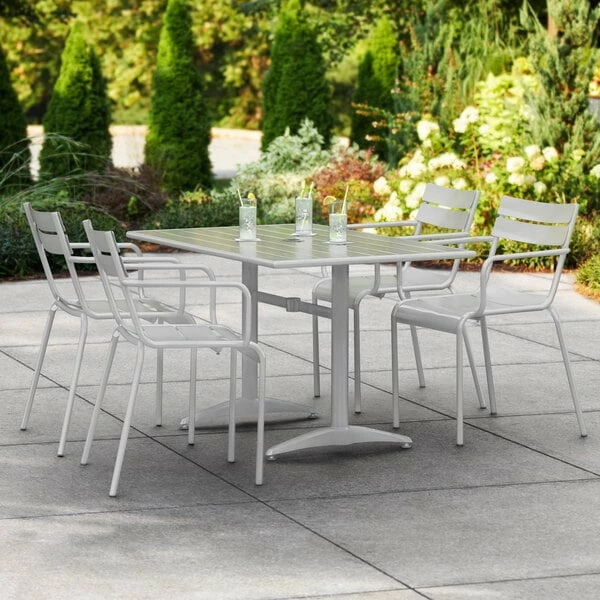 Lancaster Table & Seating 32" X 48" Silver Powder-Coated Aluminum Dining Height Outdoor Table With Umbrella Hole And 4 Arm Chairs 1 Lancaster Table & Seating 32" X 48" Silver Powder-Coated Aluminum Dining Height Outdoor Table With Umbrella Hole And 4 Arm Chairs