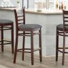 Lancaster Table & Seating Mahogany Finish Wooden Ladder Back Bar Height Chair With Dark Gray Padded Seat