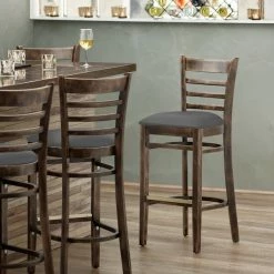 Lancaster Table & Seating Vintage Finish Wooden Ladder Back Bar Height Chair With Dark Gray Padded Seat