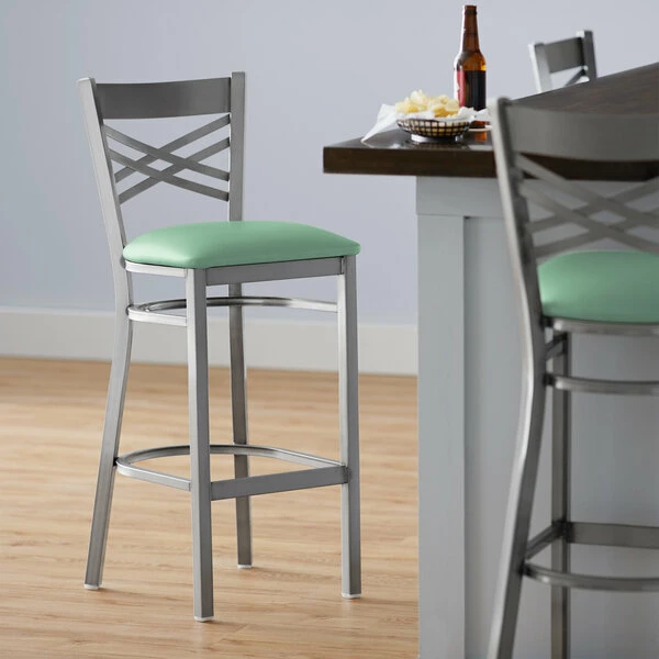 Lancaster Table & Seating Clear Coat Finish Cross Back Bar Stool With 2 1/2" Seafoam Vinyl Padded Seat 1 Lancaster Table & Seating Clear Coat Finish Cross Back Bar Stool With 2 1/2" Seafoam Vinyl Padded Seat