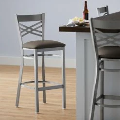 Lancaster Table & Seating Clear Coat Finish Cross Back Bar Stool With 2 1/2" Taupe Vinyl Padded Seat