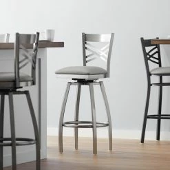 Lancaster Table & Seating Clear Coat Finish Cross Back Swivel Bar Stool With 2 1/2" Light Gray Vinyl Padded Seat