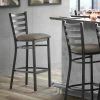 Lancaster Table & Seating Black Finish Ladder Back Bar Stool With 2 1/2" Taupe Vinyl Padded Seat