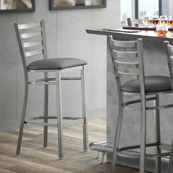 Lancaster Table & Seating Clear Coat Finish Ladder Back Bar Stool With 2 1/2" Dark Gray Vinyl Padded Seat 1 Lancaster Table & Seating Clear Coat Finish Ladder Back Bar Stool With 2 1/2" Dark Gray Vinyl Padded Seat
