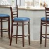 Lancaster Table & Seating Mahogany Finish Wooden Ladder Back Bar Height Chair With Blue Padded Seat