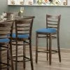 Lancaster Table & Seating Vintage Finish Wooden Ladder Back Bar Height Chair With Blue Padded Seat
