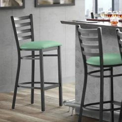 Lancaster Table & Seating Black Finish Ladder Back Bar Stool With 2 1/2" Seafoam Vinyl Padded Seat