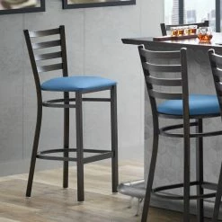 Lancaster Table & Seating Distressed Copper Finish Ladder Back Bar Stool With 2 1/2" Blue Vinyl Padded Seat