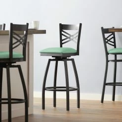 Lancaster Table & Seating Black Finish Cross Back Swivel Bar Stool With 2 1/2" Seafoam Vinyl Padded Seat