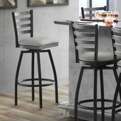 Lancaster Table & Seating Black Finish Ladder Back Swivel Bar Stool With 2 1/2" Light Gray Vinyl Padded Seat