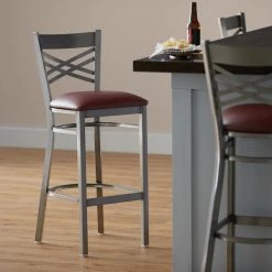 Lancaster Table & Seating Clear Coat Finish Cross Back Bar Stool With 2 1/2" Burgundy Vinyl Padded Seat