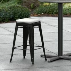 LT&S Alloy Series Lancaster Table & Seating Alloy Series Black Stackable Metal Indoor / Outdoor Industrial Cafe Counter Height Stool With Gray Fabric Magnetic Cushion