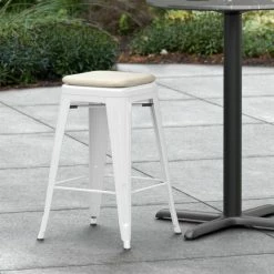 LT&S Alloy Series Lancaster Table & Seating Alloy Series White Stackable Metal Indoor / Outdoor Industrial Cafe Counter Height Stool With Tan Fabric Magnetic Cushion