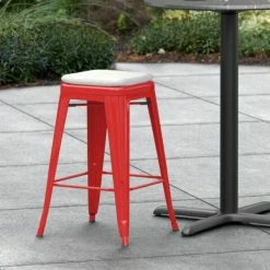 LT&S Alloy Series Lancaster Table & Seating Alloy Series Red Stackable Metal Indoor / Outdoor Industrial Cafe Counter Height Stool With Gray Fabric Magnetic Cushion