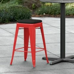 LT&S Alloy Series Lancaster Table & Seating Alloy Series Red Stackable Metal Indoor / Outdoor Industrial Cafe Counter Height Stool With Black Fabric Magnetic Cushion