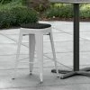 LT&S Alloy Series Lancaster Table & Seating Alloy Series Silver Stackable Metal Indoor / Outdoor Industrial Cafe Counter Height Stool With Black Fabric Magnetic Cushion