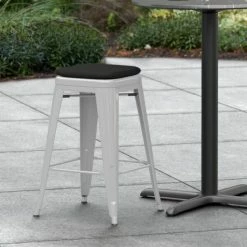 LT&S Alloy Series Lancaster Table & Seating Alloy Series Silver Stackable Metal Indoor / Outdoor Industrial Cafe Counter Height Stool With Black Fabric Magnetic Cushion