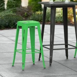 LT&S Alloy Series Lancaster Table & Seating Alloy Series Distressed Green Stackable Metal Indoor / Outdoor Industrial Barstool With Drain Hole Seat
