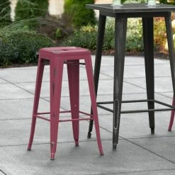 LT&S Alloy Series Lancaster Table & Seating Alloy Series Distressed Sangria Stackable Metal Indoor / Outdoor Industrial Barstool With Drain Hole Seat