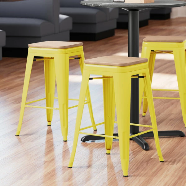 LT&S Alloy Series Lancaster Table & Seating Alloy Series Yellow Metal Indoor Industrial Cafe Counter Height Stool With Natural Wood Seat 1 LT&S Alloy Series Lancaster Table & Seating Alloy Series Yellow Metal Indoor Industrial Cafe Counter Height Stool With Natural Wood Seat