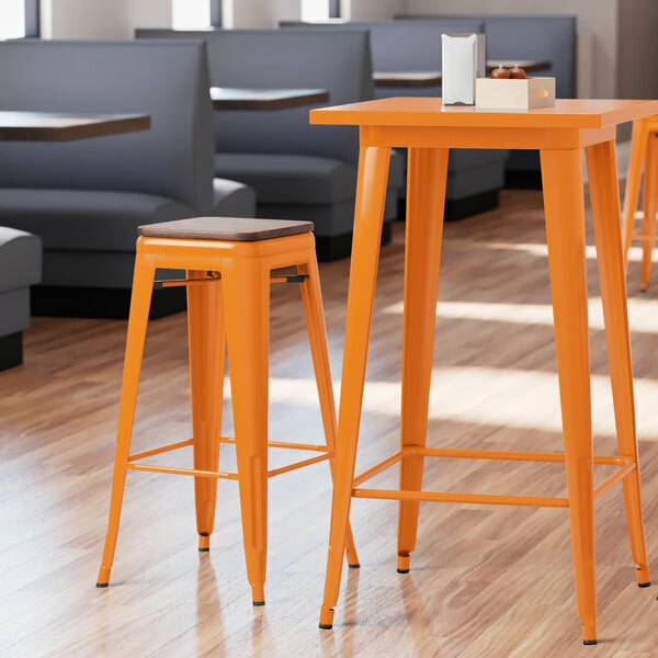 LT&S Alloy Series Lancaster Table & Seating Alloy Series Orange Metal Indoor Industrial Cafe Bar Height Stool With Walnut Wood Seat 1 LT&S Alloy Series Lancaster Table & Seating Alloy Series Orange Metal Indoor Industrial Cafe Bar Height Stool With Walnut Wood Seat