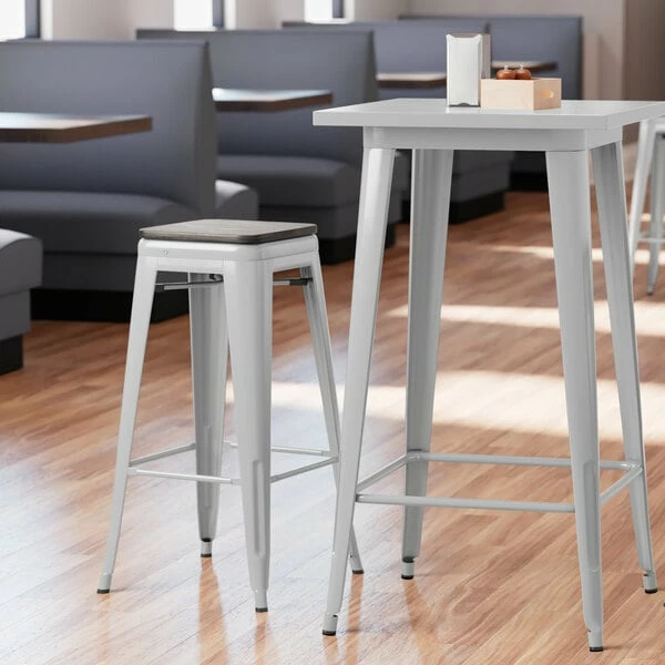 LT&S Alloy Series Lancaster Table & Seating Alloy Series Silver Metal Indoor Industrial Cafe Bar Height Stool With Black Wood Seat 1 LT&S Alloy Series Lancaster Table & Seating Alloy Series Silver Metal Indoor Industrial Cafe Bar Height Stool With Black Wood Seat