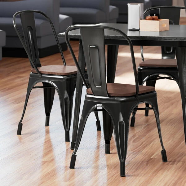 LT&S Alloy Series Lancaster Table & Seating Alloy Series Distressed Black Metal Indoor Industrial Cafe Chair With Vertical Slat Back And Walnut Wood Seat 1 LT&S Alloy Series Lancaster Table & Seating Alloy Series Distressed Black Metal Indoor Industrial Cafe Chair With Vertical Slat Back And Walnut Wood Seat