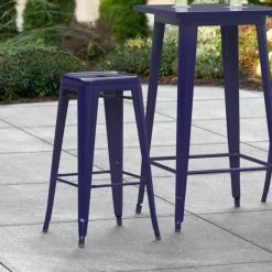 LT&S Alloy Series Lancaster Table & Seating Alloy Series Navy Stackable Metal Indoor / Outdoor Industrial Barstool With Drain Hole Seat