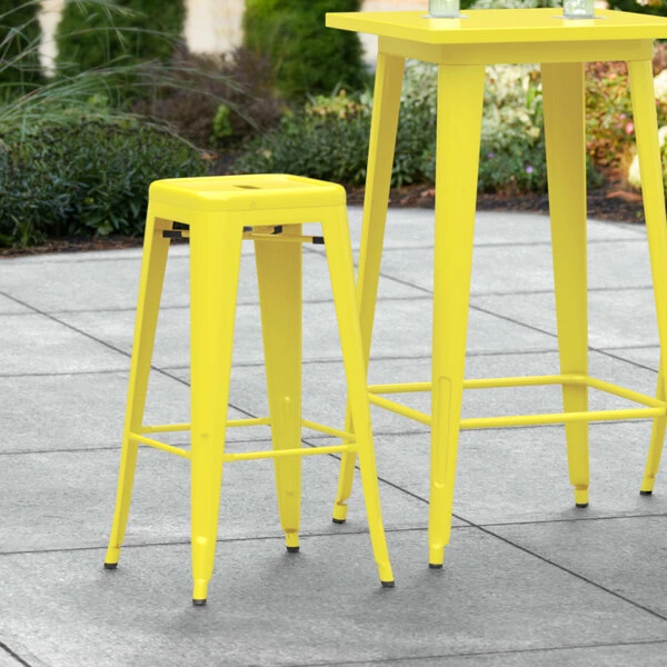 LT&S Alloy Series Lancaster Table & Seating Alloy Series Yellow Stackable Metal Indoor / Outdoor Industrial Barstool With Drain Hole Seat 1 LT&S Alloy Series Lancaster Table & Seating Alloy Series Yellow Stackable Metal Indoor / Outdoor Industrial Barstool With Drain Hole Seat