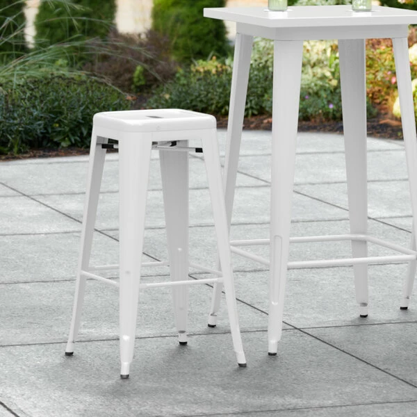 LT&S Alloy Series Lancaster Table & Seating Alloy Series White Stackable Metal Indoor / Outdoor Industrial Barstool With Drain Hole Seat 1 LT&S Alloy Series Lancaster Table & Seating Alloy Series White Stackable Metal Indoor / Outdoor Industrial Barstool With Drain Hole Seat