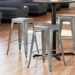 LT&S Alloy Series Lancaster Table & Seating Alloy Series Clear Coated Stackable Metal Indoor Industrial Cafe Counter Height Stool With Drain Hole Seat